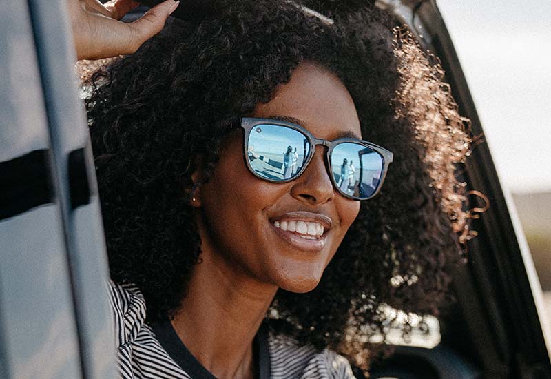 Sunglasses with Indigo Ink Frames and Polarized Snow Opal Lenses, Model