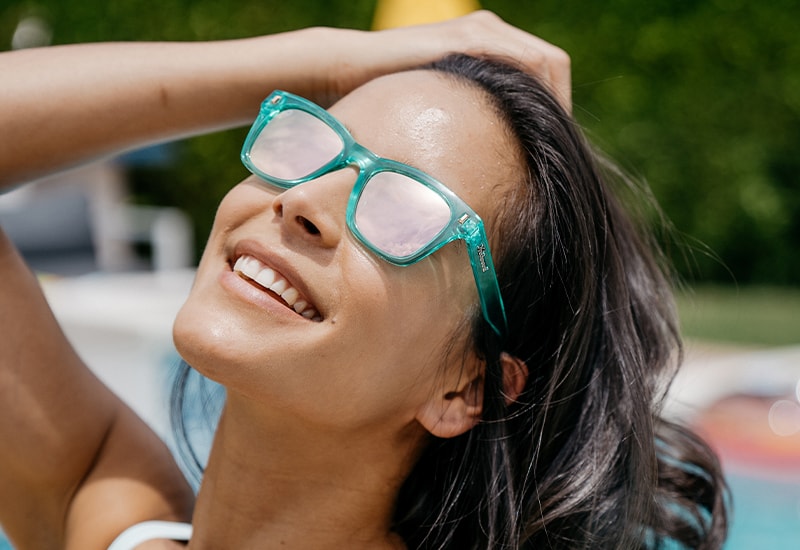 Sunglasses with Glossy Green Frames and Polarized Pink Lenses, Model