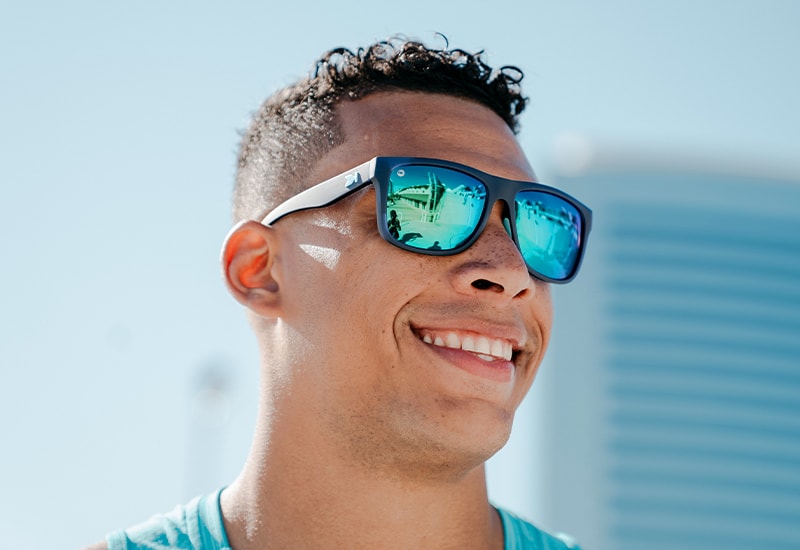 Sunglasses with Navy Frames and Polarized Green Lenses, Model