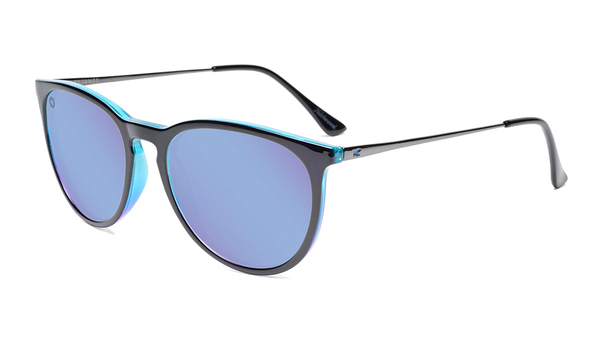 Sunglasses with Glossy Black Exterior and Ice Blue to Lavender Interior and Polarized Snow Opal Lenses. Flyover