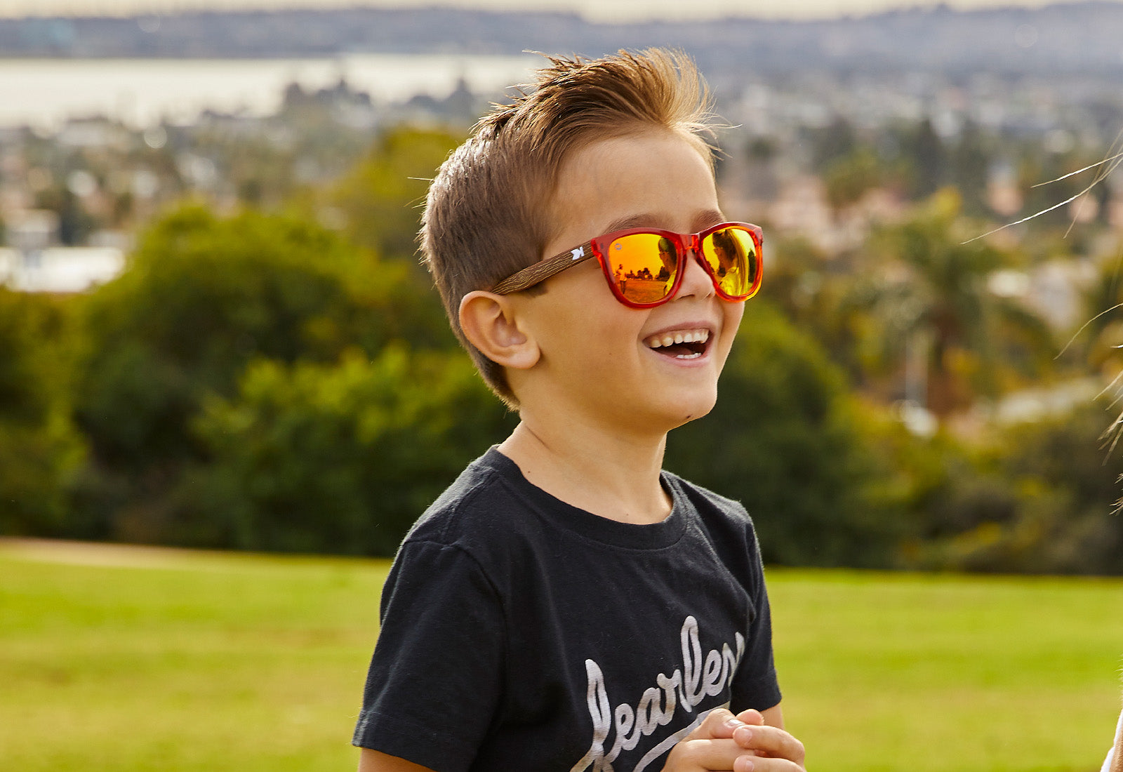 A boy kid wearing sunglasses