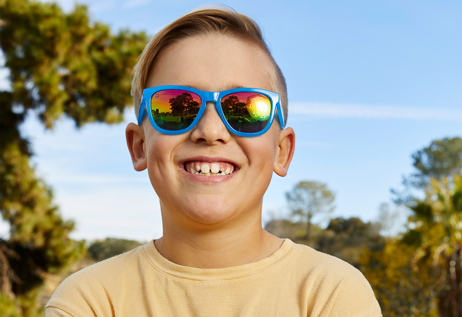 A boy kid wearing sunglasses