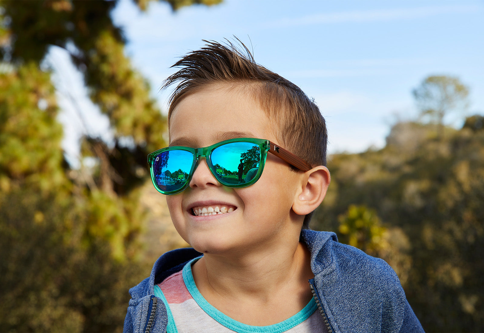 A boy kid wearing sunglasses